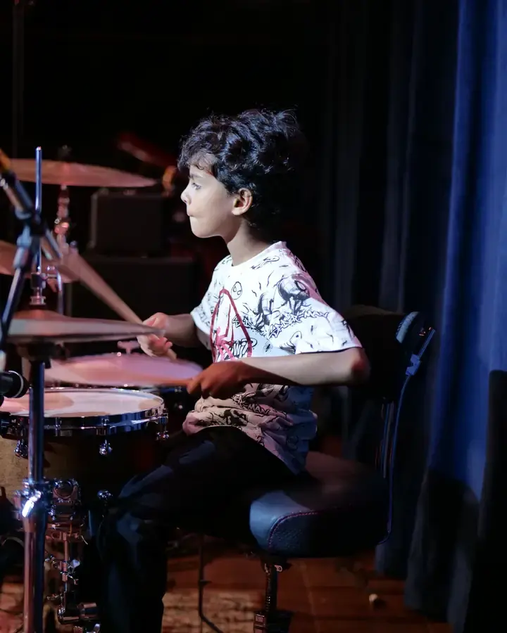 Prism students on stage and in class
