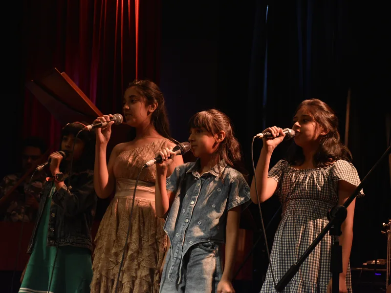 Singers on stage, Origin Story