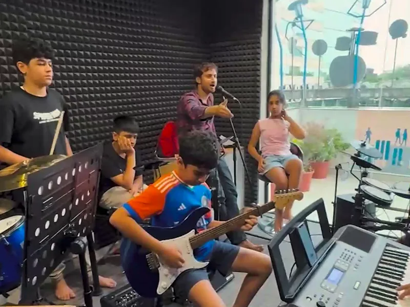 A student band rehearsal, Origin Story